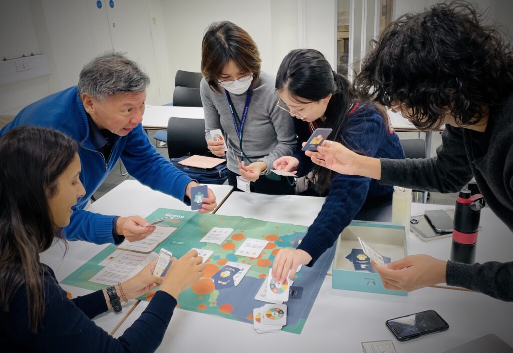 Group of students playing the FluFighter card game